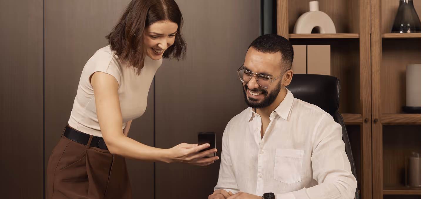 Creator demonstrating a productivity device to a customer